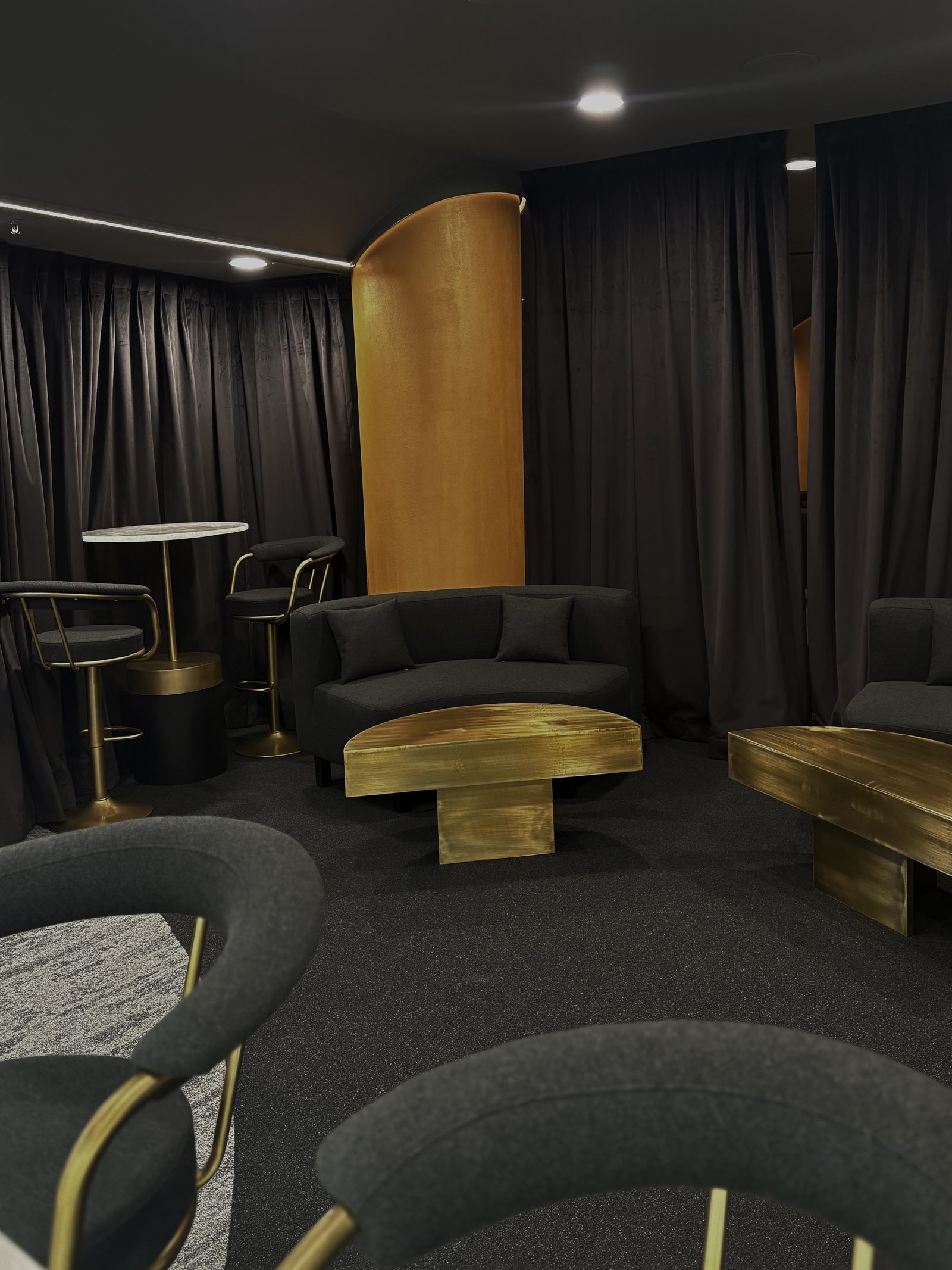 Amber Lounge suite lounge area with signature gold pillar