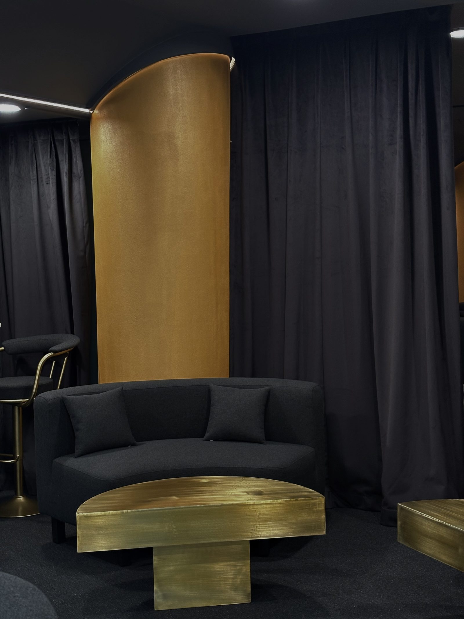Amber Lounge suite seating with gold accents and feature lighting